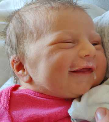 Nora's milk drunk smile.